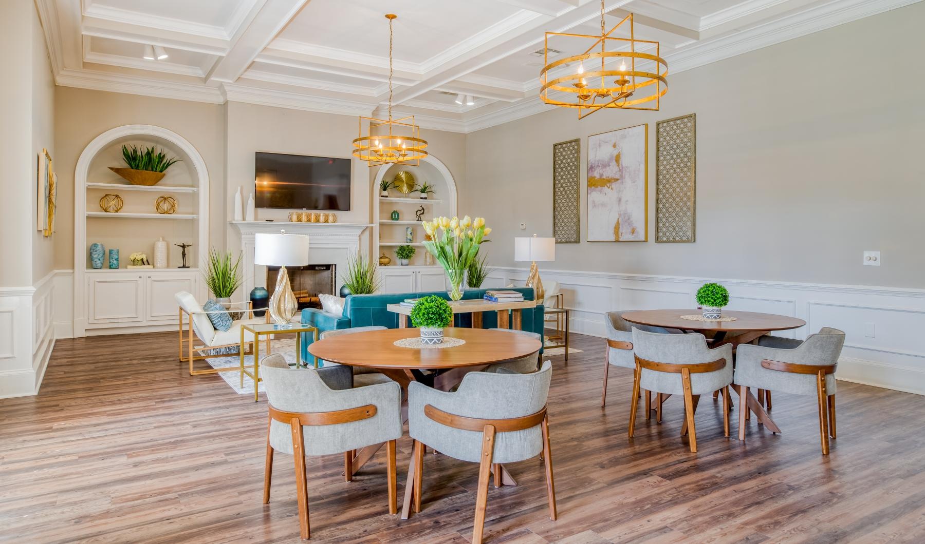 Settle into comfort at Veranda Knolls a room with tables and chairs