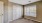 a room with white doors and a window