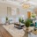 a living room with a chandelier and a table