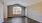 a room with a wood floor and a window with a wood floor