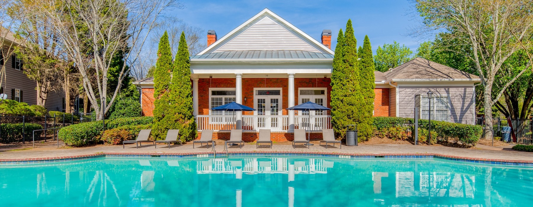 a swimming pool in front of a house
