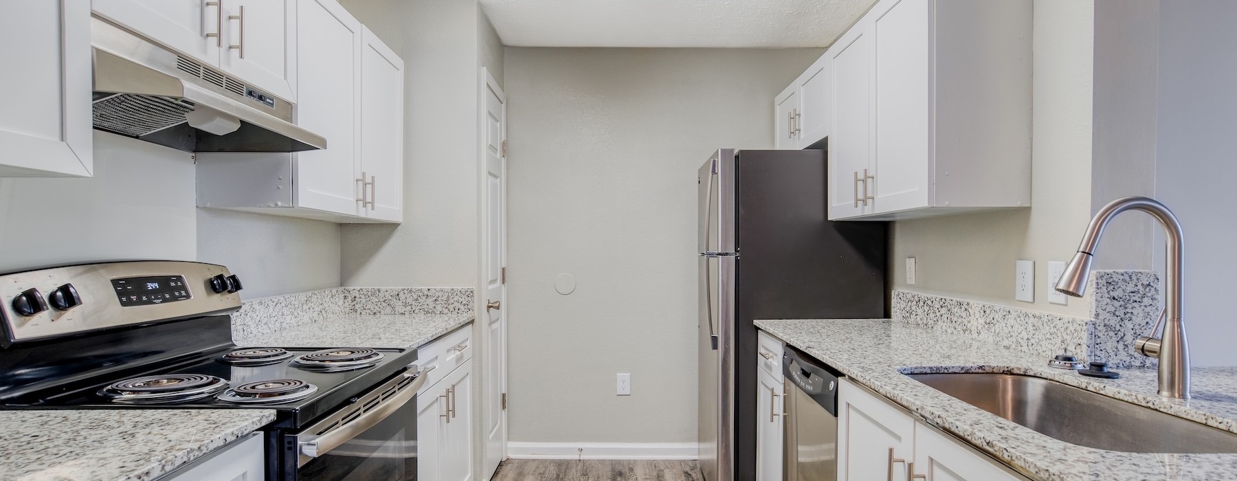 a kitchen with white cabinets