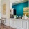 a kitchen with a blue wall