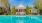 a swimming pool in front of a house